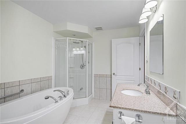 Bathroom Access to Both the Hallway & Directly into the Primary Suite... convenient! | Image 26
