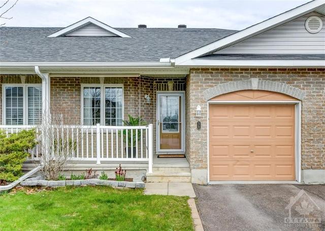 58 Frieday Street is a warm and inviting townhouse bungalow with 3 bedrooms, 3 full bathroom, and a sprawling finished basement. | Image 1