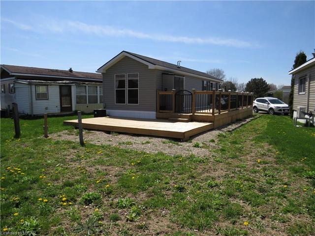 side deck and back deck on a large lot with space for a driveway | Image 20