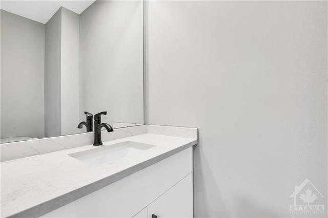 Beautiful new main floor bathroom with quartz counters | Image 11