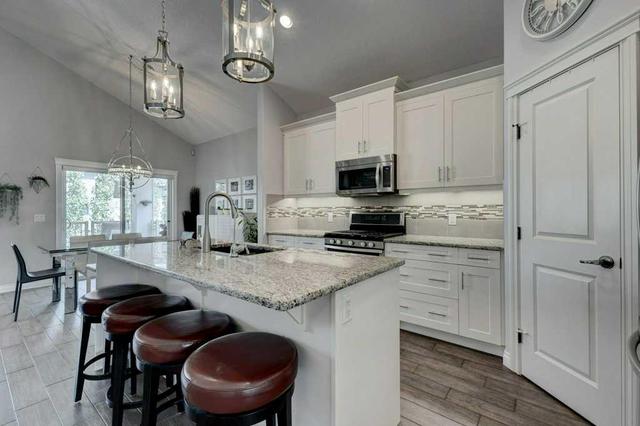125 Bayside Crt Sw, House detached with 4 bedrooms, 4 bathrooms and 4 parking in Airdrie AB | Image 4