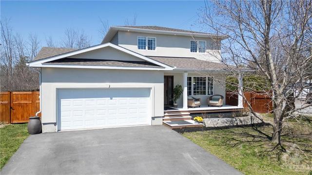 Spectacular remodelled detached home sitting on a pristinely landscaped corner lot, with no rear neighbours. | Image 1