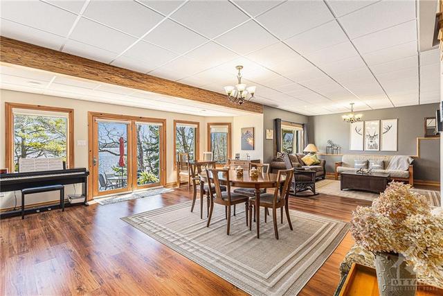 Expansive lower level family room and dining area any quest would be happy to stay in. | Image 14