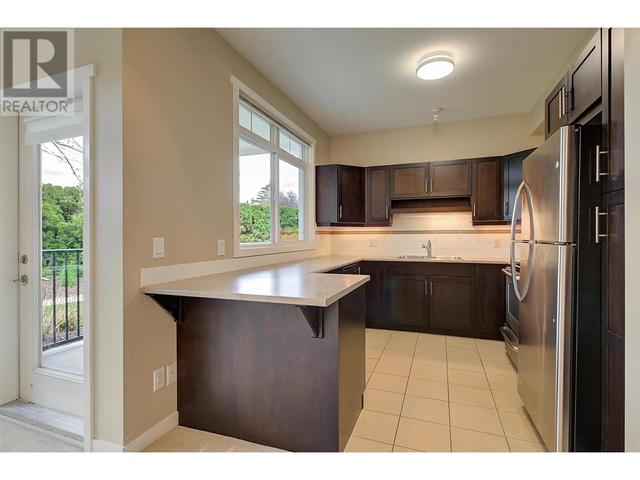 104 - 1350 Ridgeway Dr, Condo with 2 bedrooms, 2 bathrooms and 1 parking in Kelowna BC | Image 10