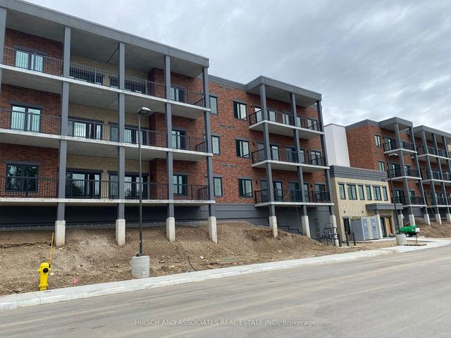 406 - 121 Mary St, Condo with 2 bedrooms, 2 bathrooms and 1 parking in Clearview ON | Image 1