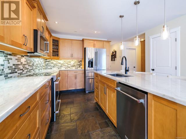 Kitchen - Maple cabinets and quartzite countertops | Image 13