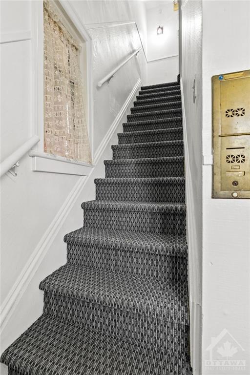 Stairs to unit 2 and 3. New carpets in 2023. | Image 10