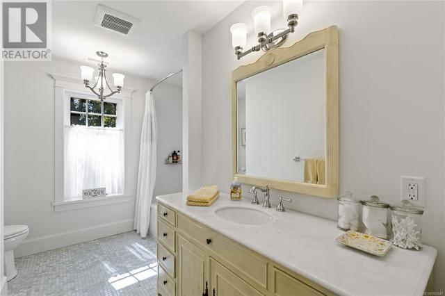 Main bathroom with custom vanity and heated marble floors | Image 45