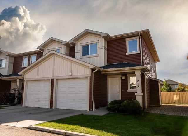 1 - 213 Silkstone Rd W, Home with 3 bedrooms, 2 bathrooms and 2 parking in Lethbridge AB | Image 1