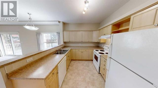 401 - 9914 101, Home with 2 bedrooms, 2 bathrooms and null parking in Grande Prairie AB | Image 3