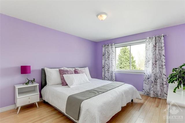 Generous primary bedroom located at the back of the house. | Image 15