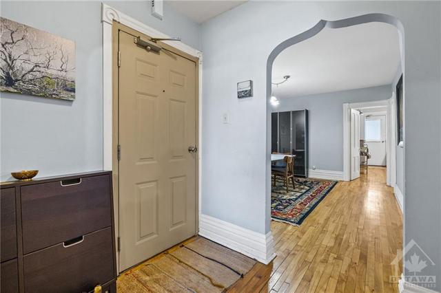 2nd unit- 2 bedroom +Den.  Spacious entrance way to this beautiful unit. Arched doorway that adds character. Beautiful hardwood floor. | Image 11