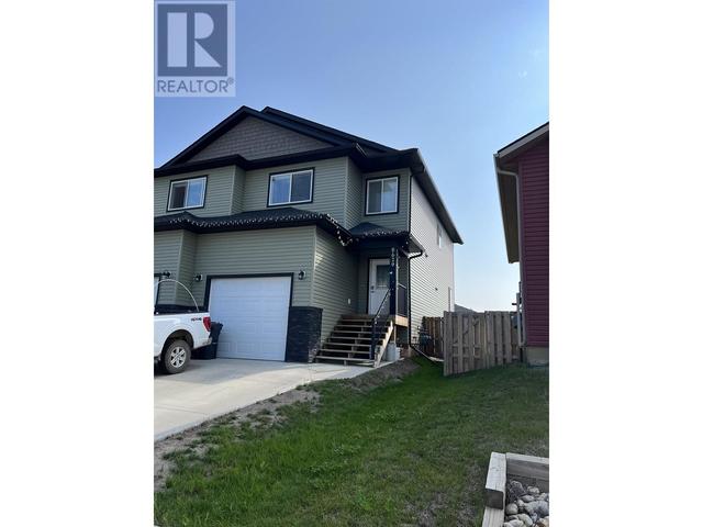 8629 85 St, House attached with 3 bedrooms, 3 bathrooms and null parking in Fort St. John BC | Image 1