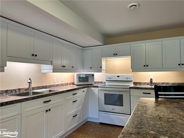 A second kitchen for lower level entertaining. | Image 35