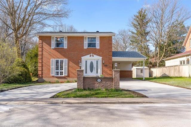 Welcome to this exquisite 4-bedroom, 2-bathroom brick residence, where timeless Georgian colonial architecture seamlessly melds with modern sophistication. | Image 1
