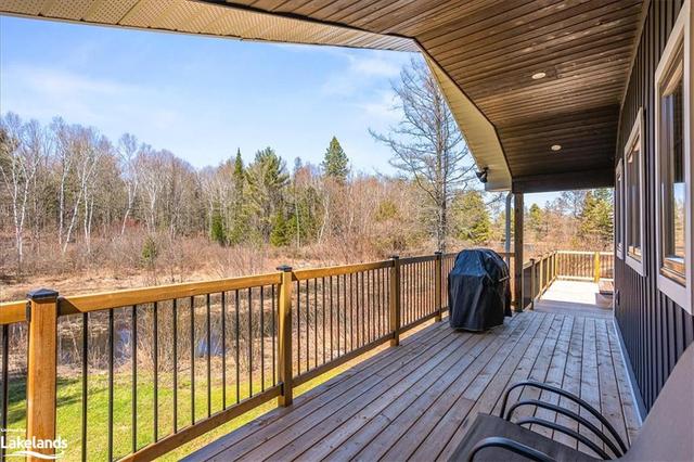 Covered deck with pond view | Image 18
