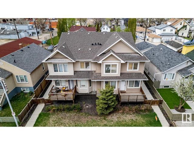 9648 106 Ave Nw, House attached with 4 bedrooms, 2 bathrooms and null parking in Edmonton AB | Image 2