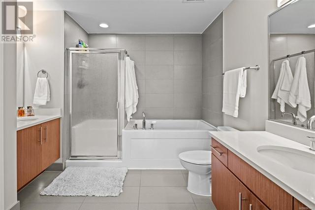 Huge bathroom with dual vanities and a separate shower and soaker tub | Image 18