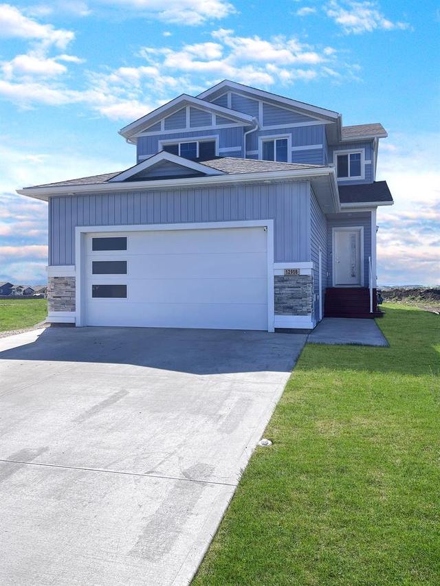 12918 102a Street, House detached with 4 bedrooms, 3 bathrooms and 6 parking in Grande Prairie AB | Image 1
