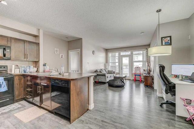 210 - 48 Panatella Road Nw, Condo with 2 bedrooms, 2 bathrooms and 1 parking in Calgary AB | Image 1