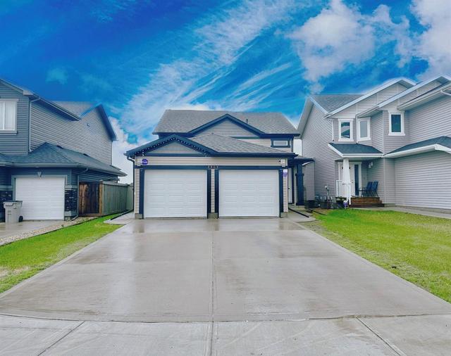 8809 94 Avenue, House other with 5 bedrooms, 2 bathrooms and 4 parking in Grande Prairie AB | Image 1