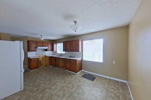 23 Bennett Crescent, House detached with 3 bedrooms, 1 bathrooms and 5 parking in Wood Buffalo AB | Image 6