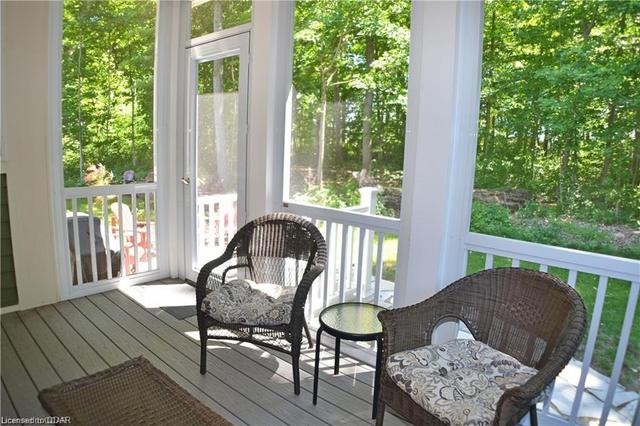 Screened porch with view into woodlands | Image 16