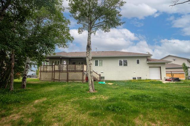 10303 99a Avenue, House detached with 6 bedrooms, 4 bathrooms and 6 parking in Sexsmith AB | Image 7