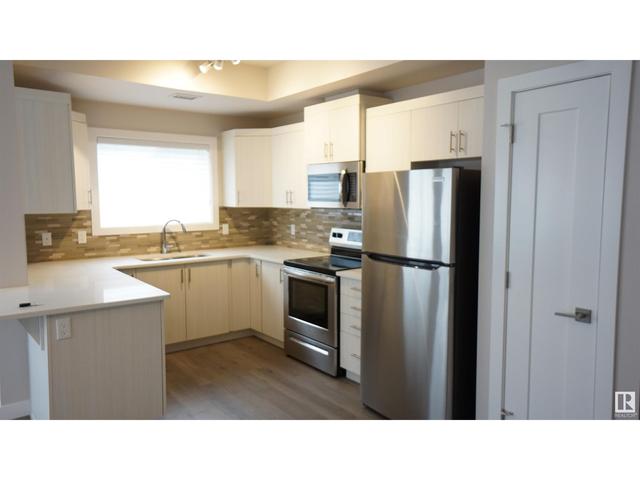 206 - 560 Griesbach Pr Nw, Condo with 2 bedrooms, 2 bathrooms and 1 parking in Edmonton AB | Image 4