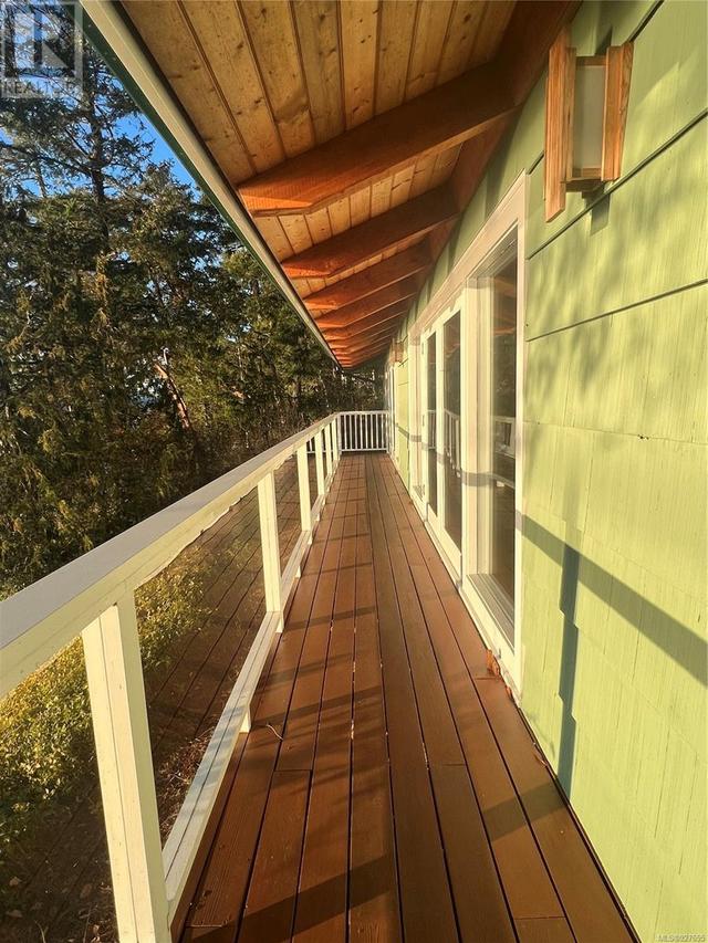 Sunny deck at pool house. | Image 20