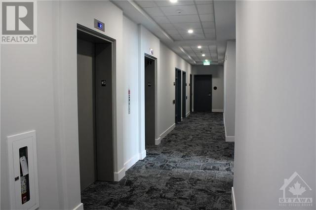 Spacious hallways and two elevators for easy access | Image 19