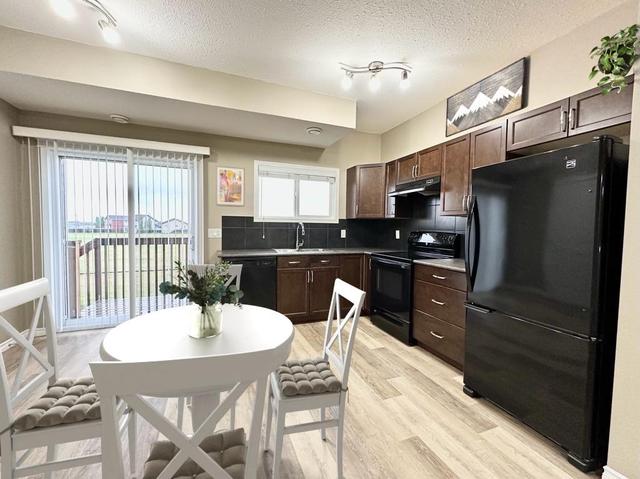 8809 94 Avenue, House other with 5 bedrooms, 2 bathrooms and 4 parking in Grande Prairie AB | Image 8
