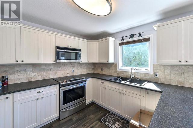 827 Springwood Court, House detached with 4 bedrooms, 2 bathrooms and null parking in Kelowna BC | Image 16