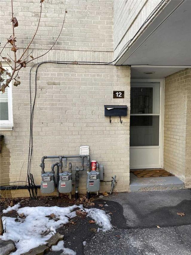 12 - 33 Four Winds Dr, Townhouse with 3 bedrooms, 2 bathrooms and 0 parking in Toronto ON | Image 1