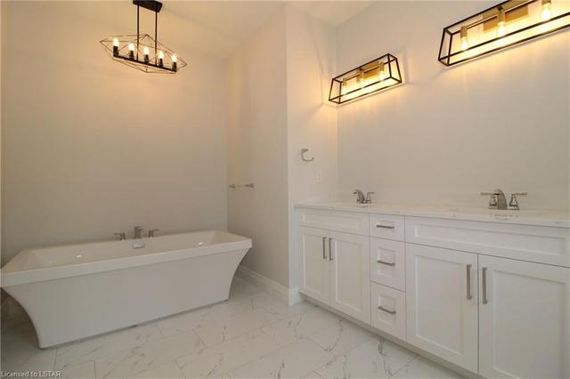 Ensuite bathroom with soaker tub, glass shower, double vanity and heated floors | Image 18