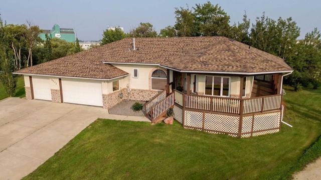 10303 99a Avenue, House detached with 6 bedrooms, 4 bathrooms and 6 parking in Sexsmith AB | Image 1