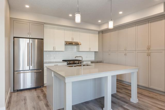 410 - 1702 17 Avenue Sw, Condo with 3 bedrooms, 2 bathrooms and 2 parking in Calgary AB | Image 2