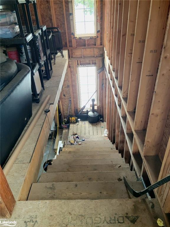 Stairs from upper garage to lower garage. | Image 24