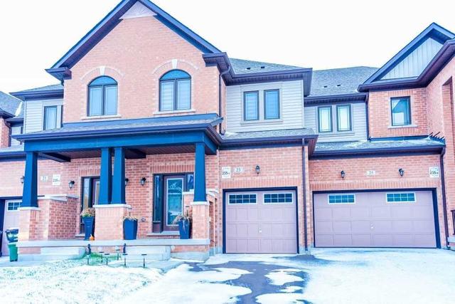 23 Arnold Cres N, House attached with 3 bedrooms, 3 bathrooms and 3 parking in New Tecumseth ON | Image 1