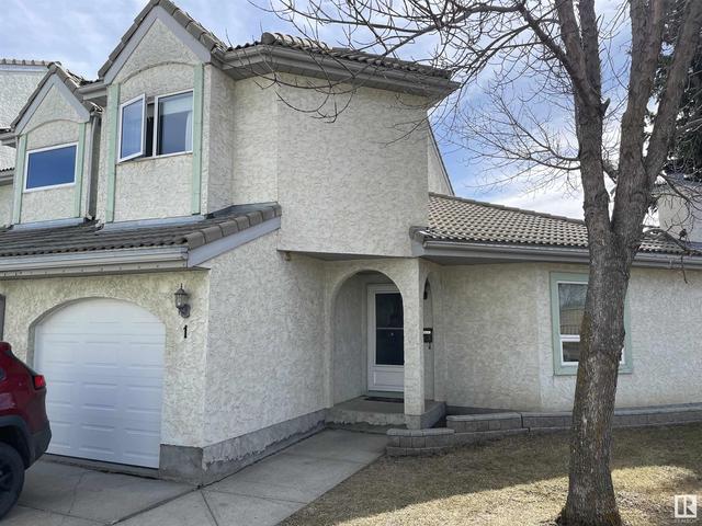 1 - 9505 176 St Nw, House attached with 2 bedrooms, 1 bathrooms and 2 parking in Edmonton AB | Image 1