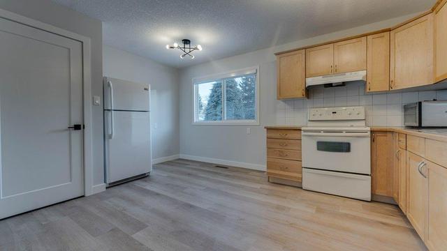 215 Tache Avenue Nw, House detached with 5 bedrooms, 2 bathrooms and 4 parking in Calgary AB | Image 1