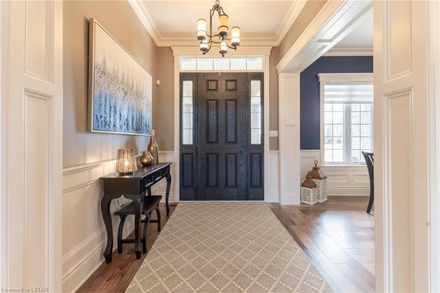 Grand foyer with quality wainscoting, tray ceiling and crown moulding | Image 19