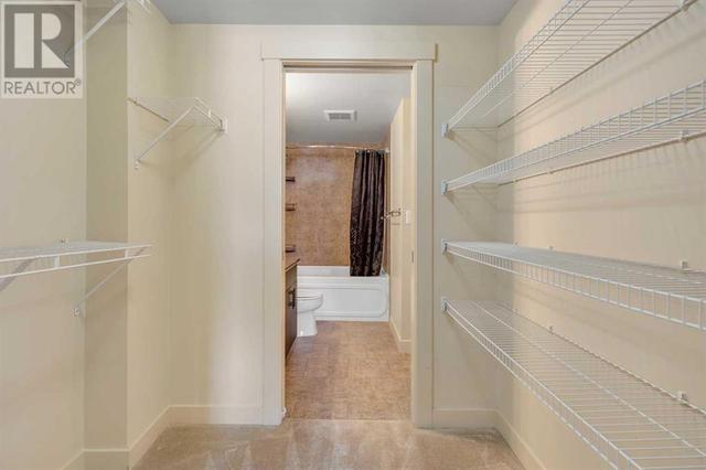 Walk through closet conveniently offers private access to bathroom | Image 25