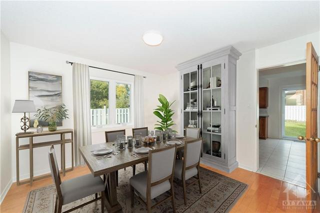 Dining room virtually staged. Room does not inlude window treatment | Image 10