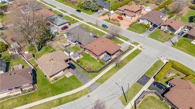 Aerial view of the rear yard and home showing the well kept homes in the neighbourhood | Image 25
