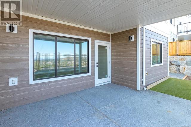 Covered patio off of lower level media room | Image 39