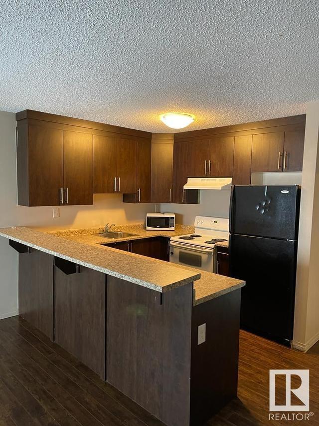 408 - 4810 Mill Woods Rd S Nw, Condo with 1 bedrooms, 1 bathrooms and 1 parking in Edmonton AB | Image 3