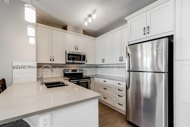 1407 - 522 Cranford Drive Se, Condo with 2 bedrooms, 2 bathrooms and 1 parking in Calgary AB | Image 2