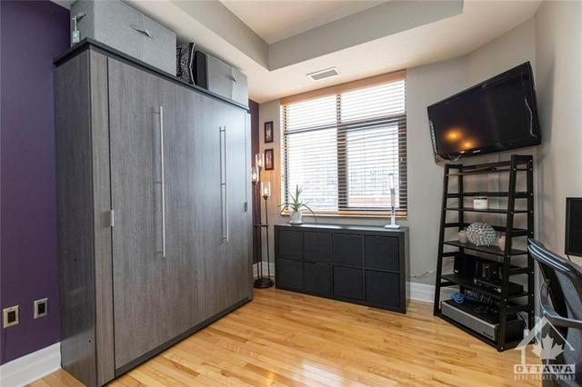 2nd bedroom provides all the additional space you need and murphy bed | Image 17