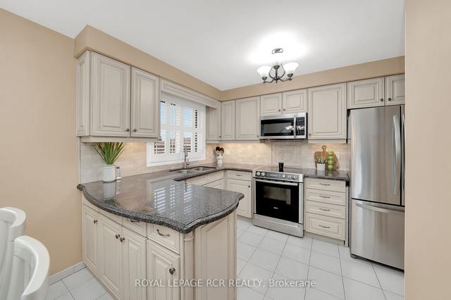 9 Slane Crt, House semidetached with 3 bedrooms, 2 bathrooms and 4 parking in Toronto ON | Image 3